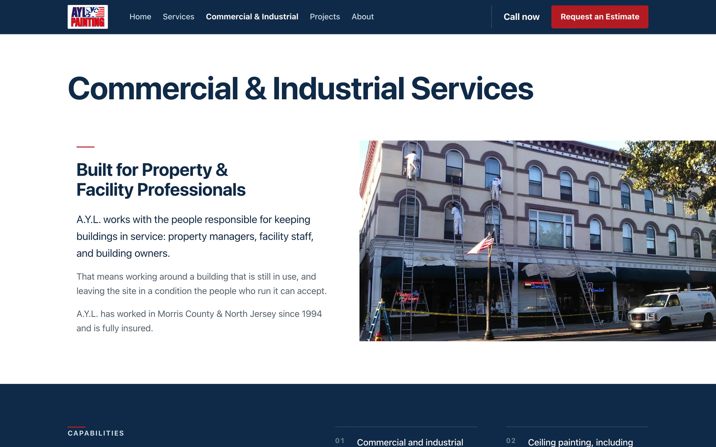 Upgraded Commercial & Industrial page, opening on a photograph of A.Y.L. crews painting a historic commercial facade
